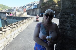 Out & About: Enjoying the sun with an ice cream. It was to hot for bra & kn...