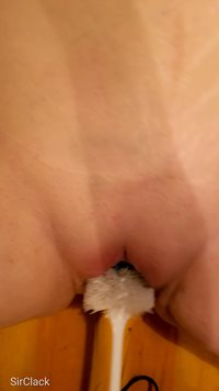 Using the brush in her pussy