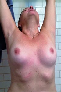 Kristi showing off her breasts
