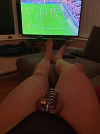 Watching the football in pantihoes lacy thong and steel cage