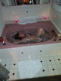 Wife enjoying a nice playful bath