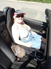 Enjoying the sun and a ride in the car. Hubby said to go topless. His wish ...