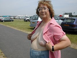Maggie showing her tits in a large car park for a Sunday market