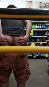 Ass cheeks spread in public showing off butt plug