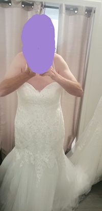 trying on dresses at the bridal store. yes including wedding dresses.