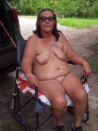 Wife relaxes in the chair while I'm fishing