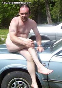 Sitting on the car on a hot summer day! I love being nude outside