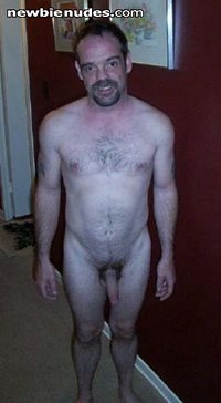 Posing nude in the hallway