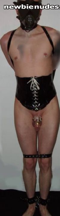 Hubby corsetted and in chastity-cuff