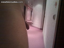 Horny in hotel hallway