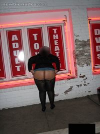 Flashing her ass outside the adult theater with people watching