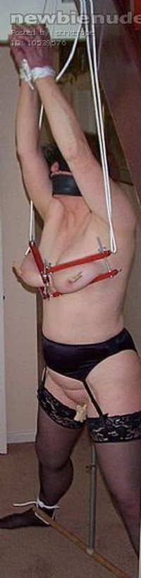 gagged, blindfolded tits clamped riding dildo on pole