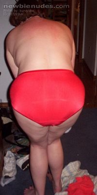 Bending over in my red panties.