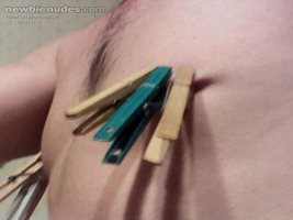 Clothes pins on my nipples